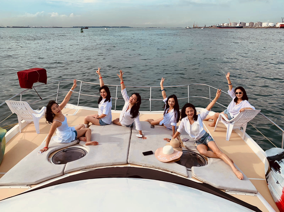 Two beautiful female friends on luxury yacht